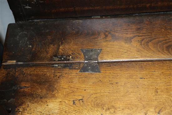 An 18th century oak box seat settle, W.3ft 9in.